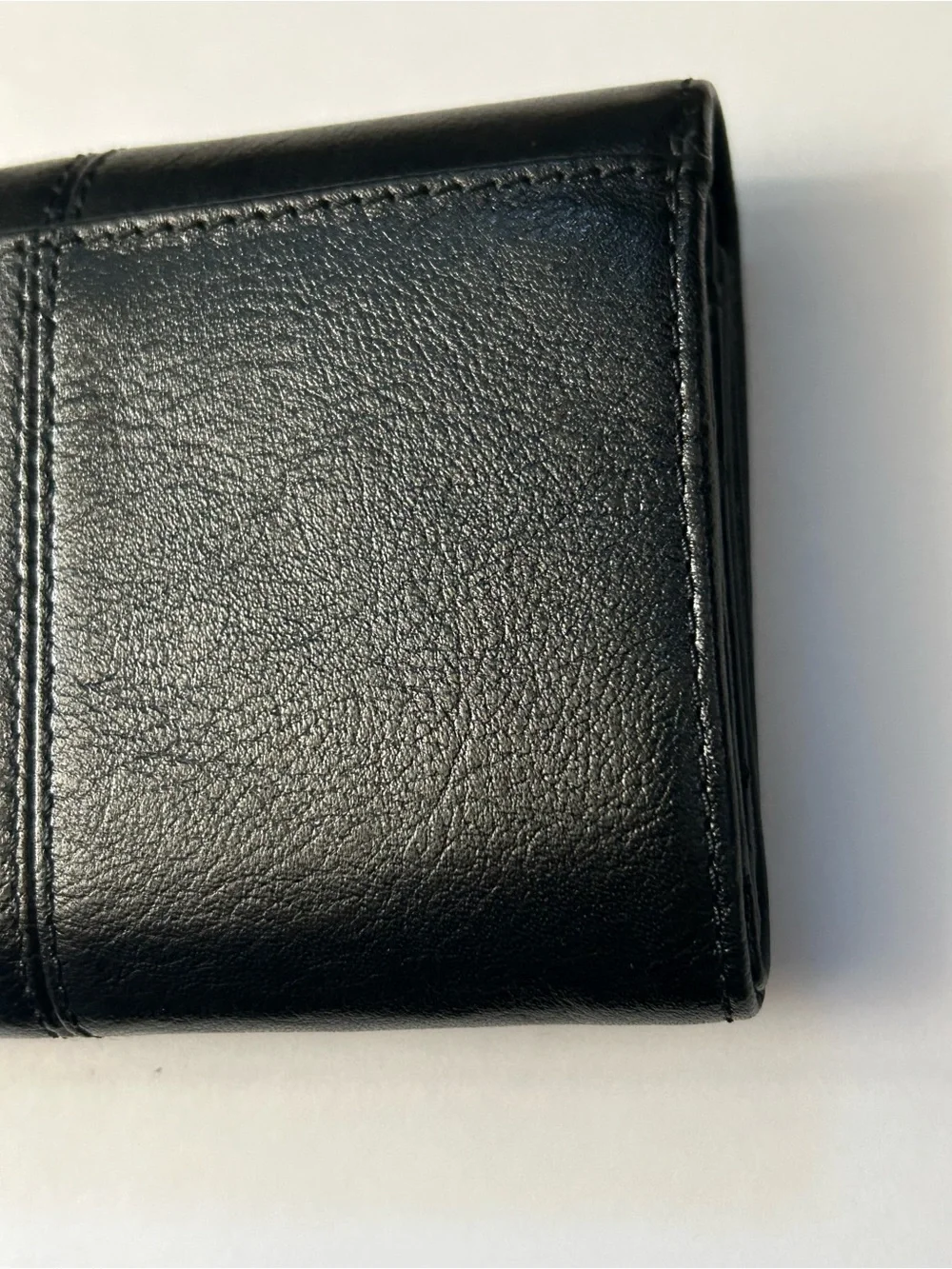 Coach Women’s Black Tri-Fold Wallet with Gold Script Logo